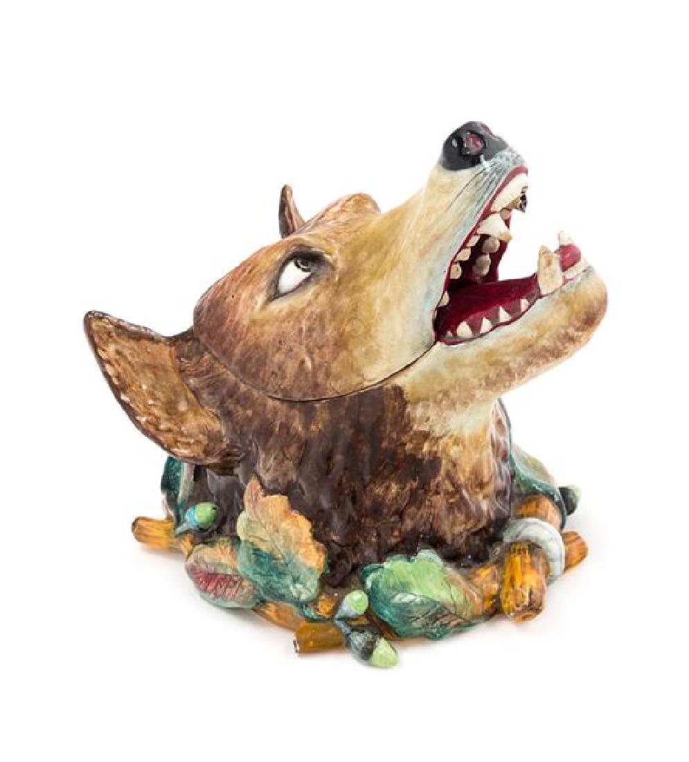 A Gien Majolica Figural Jar Height 8 3/4 inches.: A Gien Majolica Figural Jar late 19th century in the form of a fox, signed to base. Height 8 3/4 inches. Estimate $200-400 Repaired break to one tooth. Please request a complete condition report.