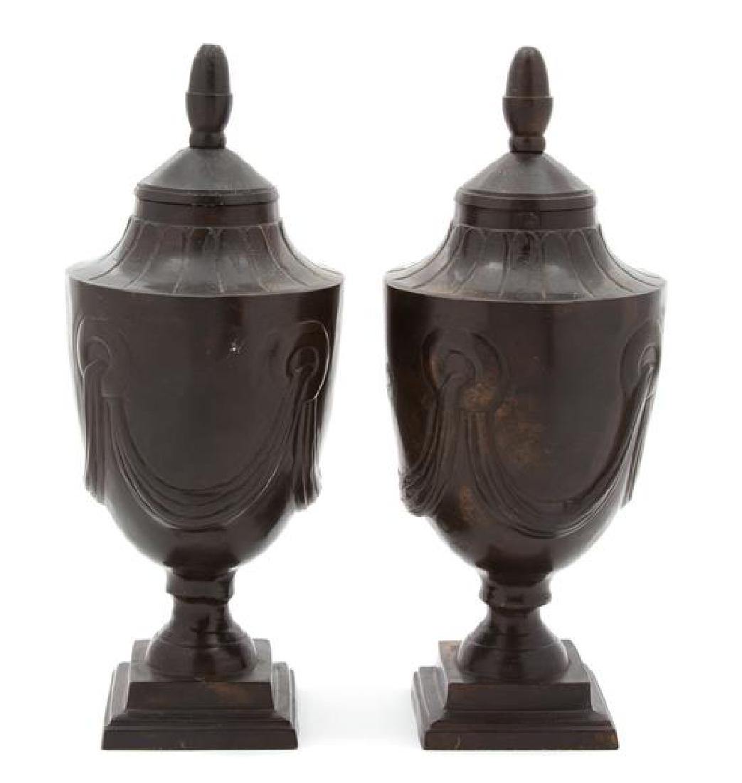 Pair of Indian Bronze Covered Urns Height 9 3/4 inches.: Pair of Indian Bronze Covered Urns 20th century Height 9 3/4 inches. Estimate $80-120 Property from the Collection of M. Anthony Greene, Atlanta, Georgia Each base with circular sticker reading HAND C