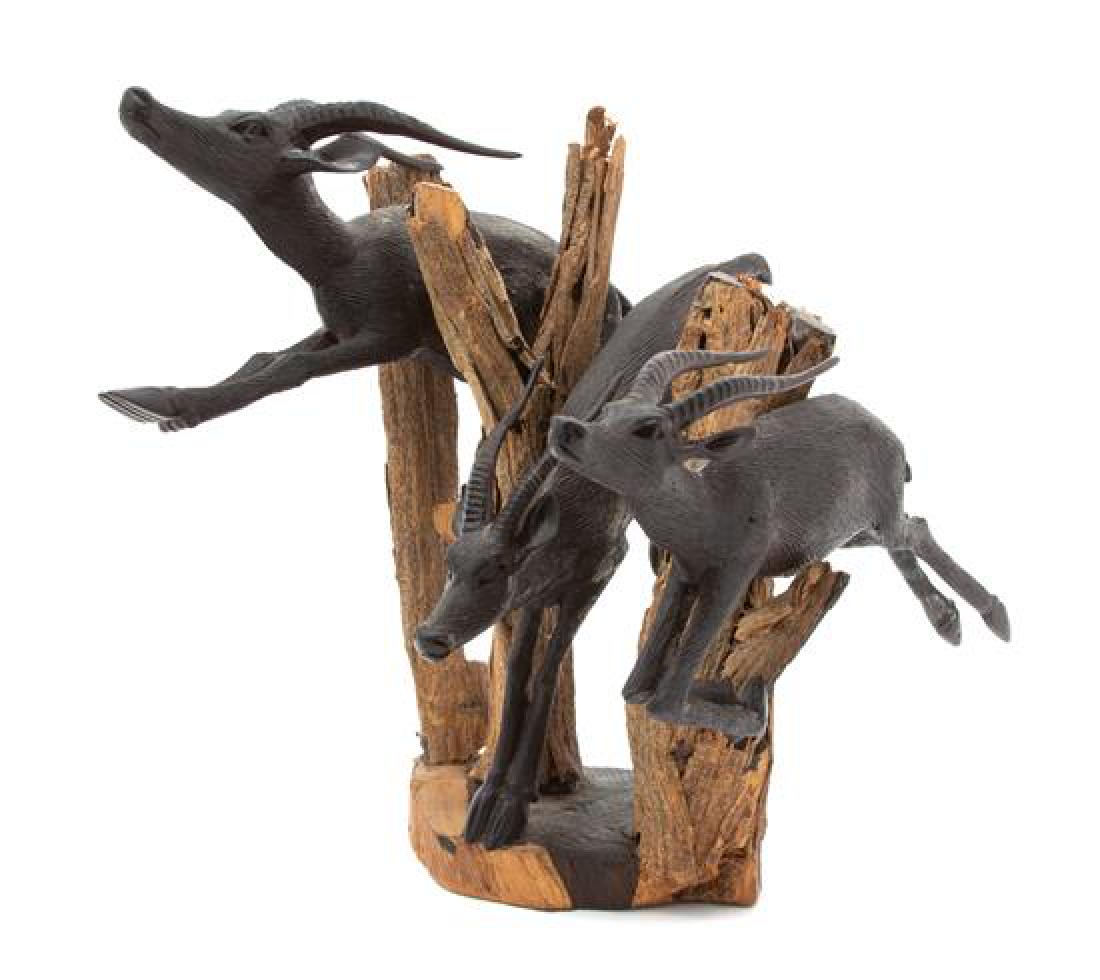 An African Peter Nziale Carved Wood Sculpture of: An African Peter Nziale Carved Wood Sculpture of Antelopes 20th century Height 9 1/2 inches. Estimate $50-100 Property from the Collection of M. Anthony Greene, Atlanta, Georgia