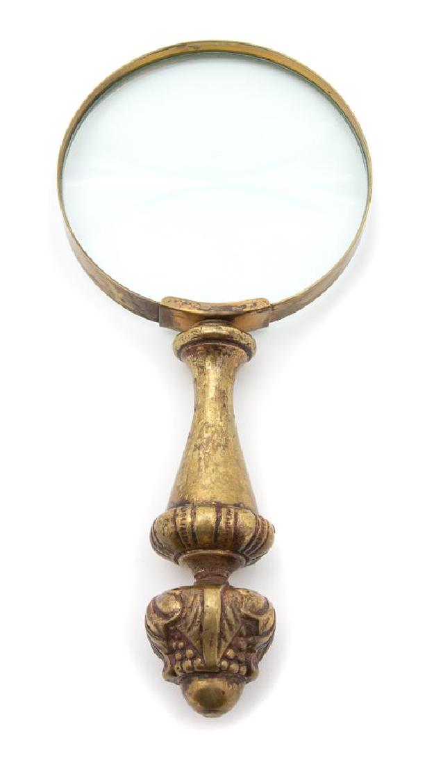 An English Brass Handled Magnifying Glass Length 9: An English Brass Handled Magnifying Glass 19th century Length 9 inches. Estimate $80-120 Property from the Collection of M. Anthony Greene, Atlanta, Georgia