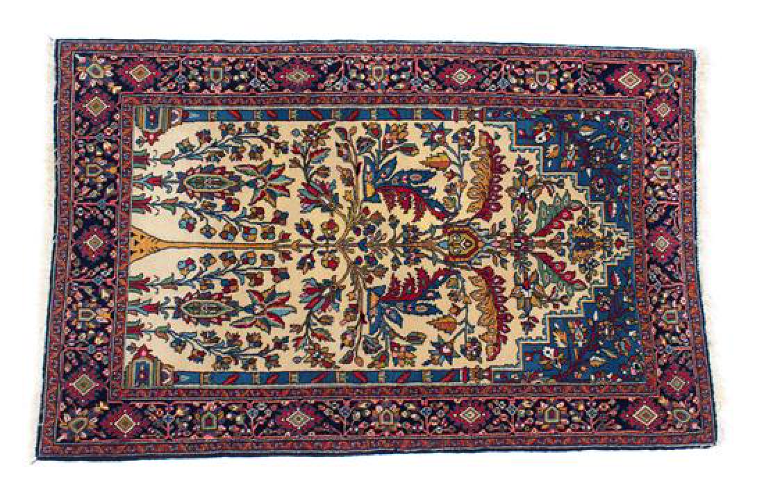 A Persian Tree-of-Life Wool Rug 62 1/2 x 43 inches.: A Persian Tree-of-Life Wool Rug 20th century 62 1/2 x 43 inches. Estimate $300-500 Property from the Collection of M. Anthony Greene, Atlanta, Georgia