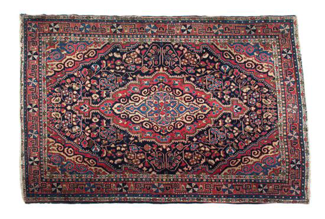 A Persian Wool Rug 57 1/2 x 39 1/2 inches.: A Persian Wool Rug 20th century 57 1/2 x 39 1/2 inches. Estimate $300-500 Property from the Collection of M. Anthony Greene, Atlanta, Georgia