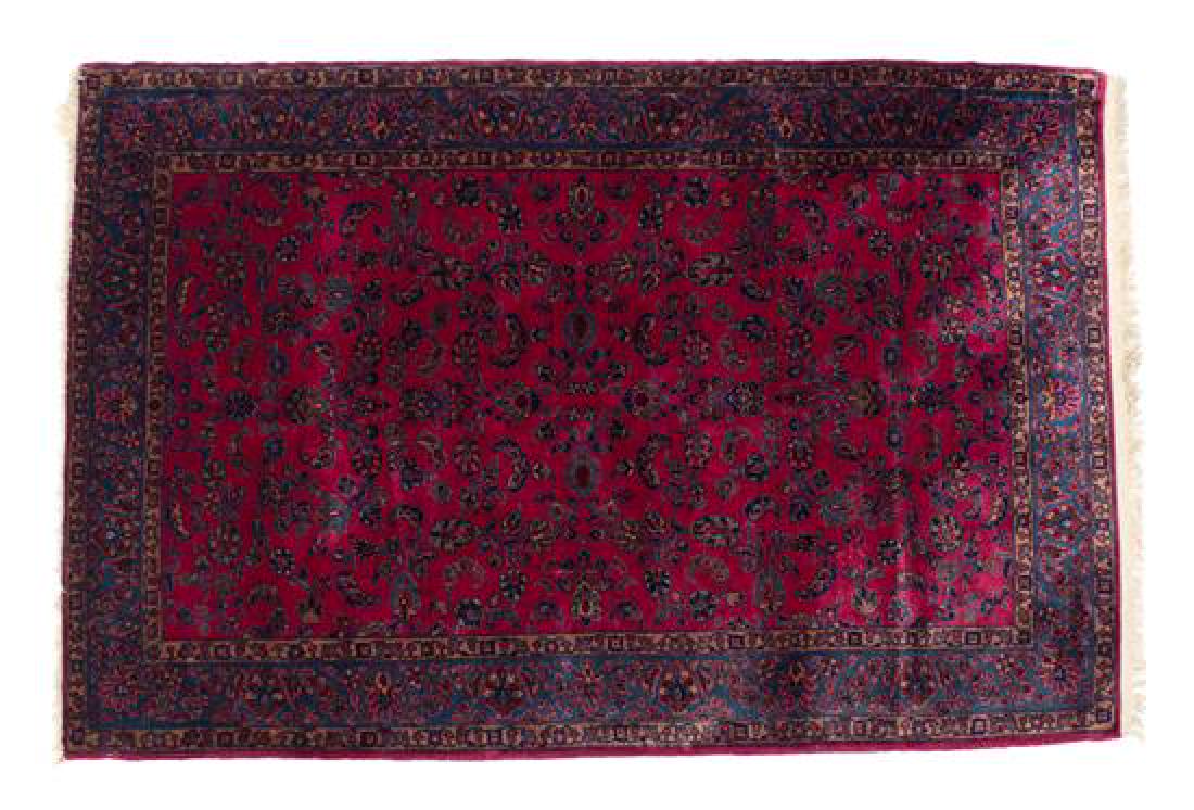 A Sarouk Wool Rug 75 1/2 x 52 1/2 inches.: A Sarouk Wool Rug 20th century 75 1/2 x 52 1/2 inches. Estimate $400-600 Property from the Collection of M. Anthony Greene, Atlanta, Georgia