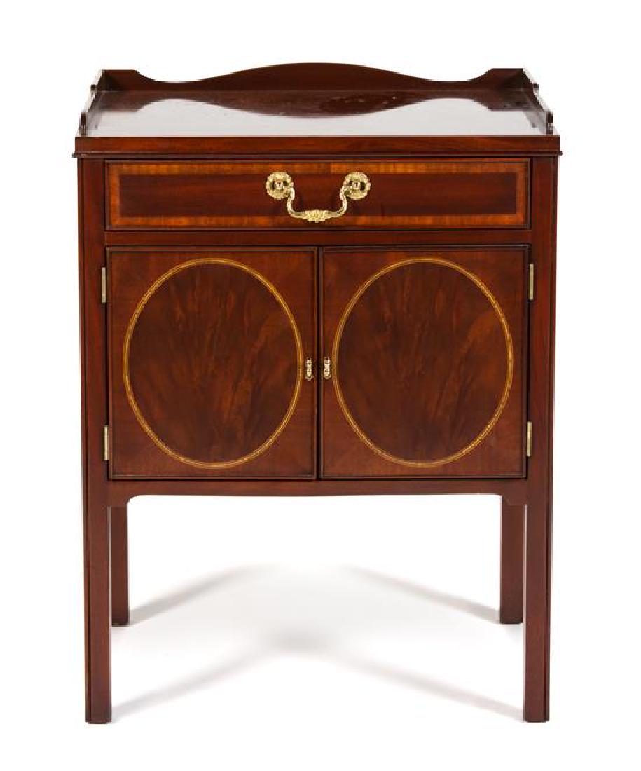 A George III Style Inlaid Mahogany Bedside Cabinet: A George III Style Inlaid Mahogany Bedside Cabinet 20th century Height 29 1/2 x width 22 x depth 16 inches. Estimate $150-250 Property from the Collection of M. Anthony Greene, Atlanta, Georgia