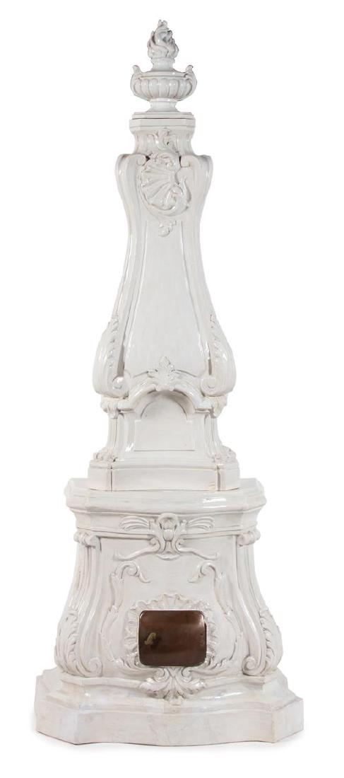 A Continental Rococo Style White Glazed Faience Stove (1 of 1)
