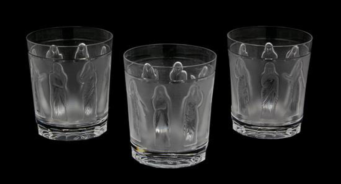 A Set of Ten Lalique Molded and Frosted Glass Whiskey: A Set of Ten Lalique Molded and Frosted Glass Whiskey Tumblers 20th century Femmes Antiques pattern, etched Lalique France on base. Height 4 inches. Estimate $400-600 Minor surface scratches to base r