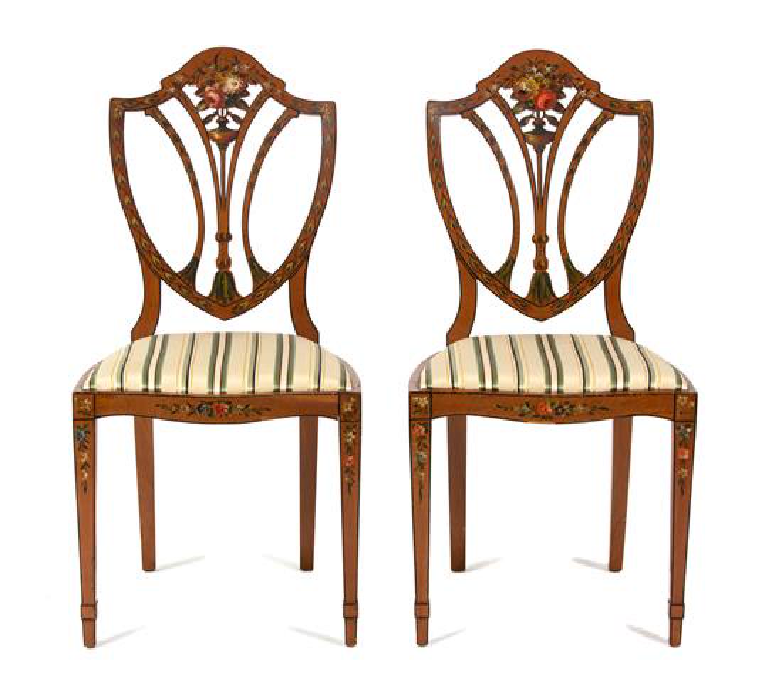 A Pair of Polychrome Floral Painted Satinwood Chairs: A Pair of Polychrome Floral Painted Satinwood Chairs having William R. Eubanks upholstered seats. Height 36 x width 18 x depth 15 1/2 inches. Estimate $200-400 Minor nicks to veneer on edge of seat of