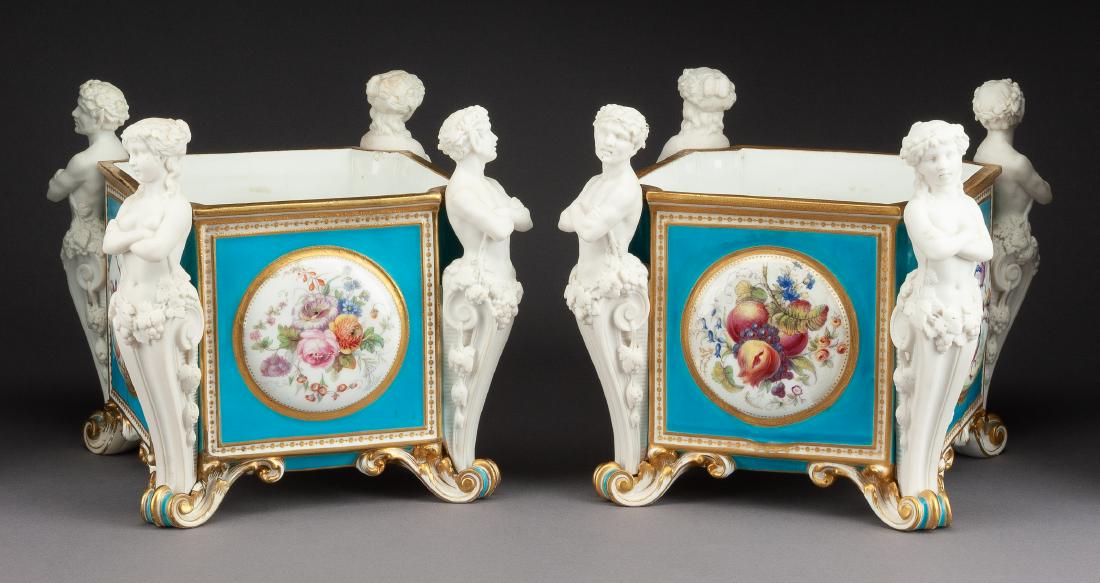 A Pair of Minton Porcelain Jardinieres Height 8 3/4: A Pair of Minton Porcelain Jardinieres 19th century each of squared form with classical herms at the corners, the sides depicting birds and floral sprays, shape number 602. Height 8 3/4 inches. Estima