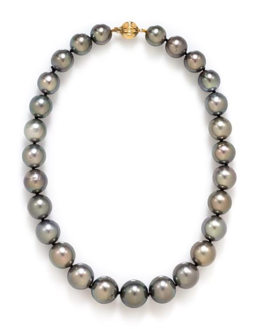 A 14 Karat Yellow Gold and Cultured Tahitian Pearl: A 14 Karat Yellow Gold and Cultured Tahitian Pearl Necklace, containing 27 Tahitian pearls measuring approximately 11.95-15.80 mm in diameter strung knotted with a yellow gold clasp. Stamp: Au585. 64.