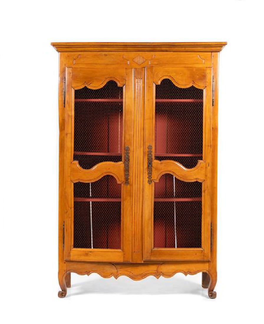 * A Louis XV Style Provincial Style Armoire Height 81 x: * A Louis XV Style Provincial Style Armoire 19th/20th century having a molded cornice over two grill inset doors, the whole raised on short cabriole legs. Height 81 x width 55 x depth 17 inches. Estim