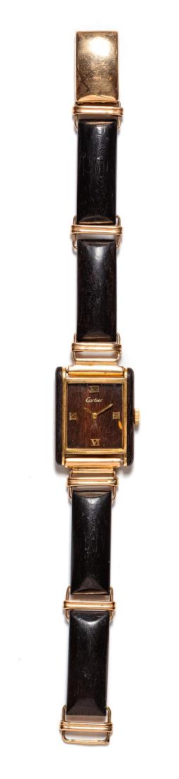 * A Gold-Plate and Wood Ref. 2512 Watch Case with 10: * A Gold-Plate and Wood Ref. 2512 Watch Case with 10 Karat Gold and Ebony Bracelet, Cartier and Allan Adler, consisting of a watch case, 23.00 x 30.00 mm case dimensions, wood dial signed Cartier, app