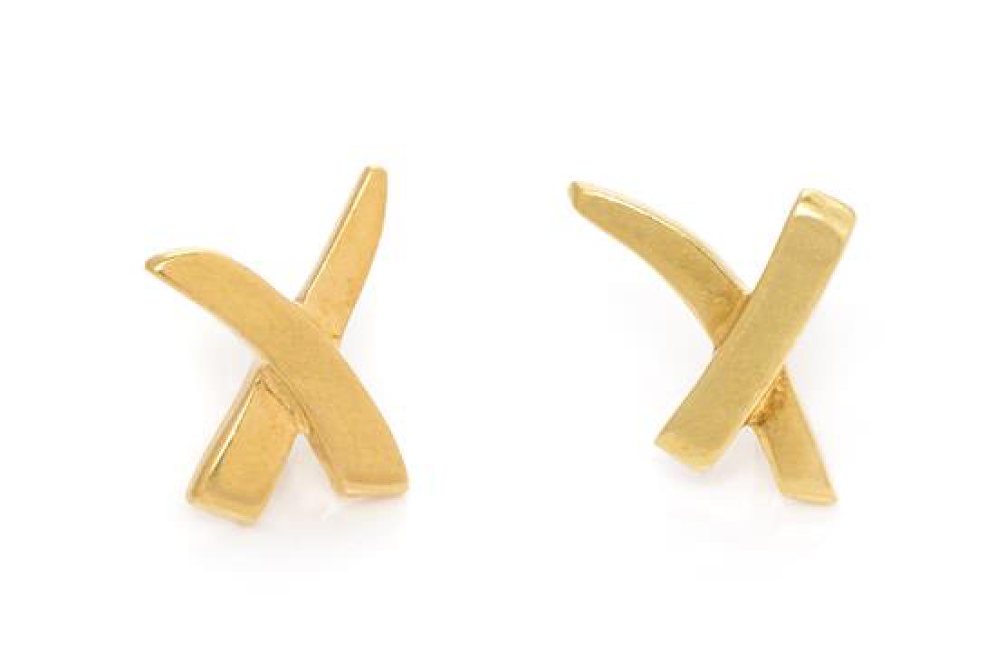 A Pair of 18 Karat Yellow Gold 'Graffiti X' Stud: A Pair of 18 Karat Yellow Gold 'Graffiti X' Stud Earrings, Paloma Picasso for Tiffany & Co., consisting of a criss-cross design measuring approximately 18.00 x 12.00 mm. Stamp: Paloma Picasso T&CO 18K