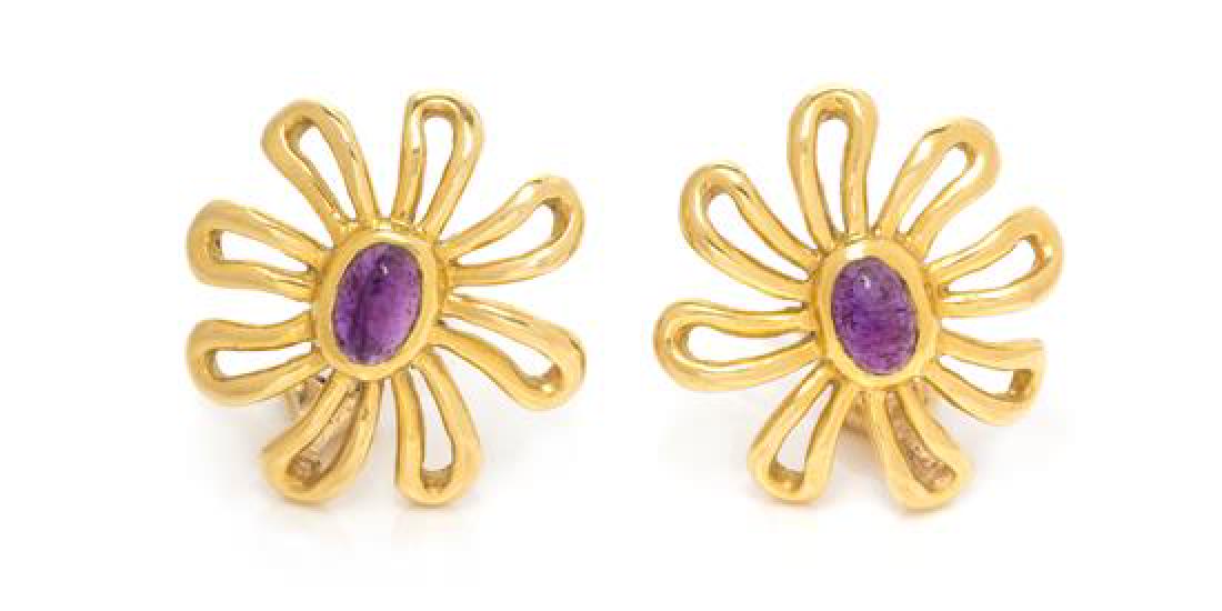 A Pair of 18 Karat Yellow Gold and Amethyst Flower: A Pair of 18 Karat Yellow Gold and Amethyst Flower Motif Earclips, Paloma Picasso for Tiffany & Co., Circa 1981, containing two oval cabochon cut amethyst measuring approximately 5.83 x 3.84 mm. Stamp