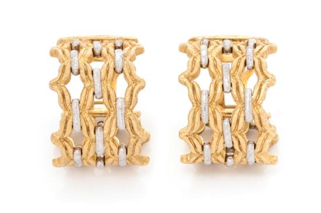 A Pair of Bicolor Gold Hoop Earclips, Gianmaria: A Pair of Bicolor Gold Hoop Earclips, Gianmaria Buccellati, consisting of an openwork woven yellow and white gold design, posts with clip backs. Engraved: GIANMARIA 18KT BUCCELLATI ITALY. 13.40 dwts. 