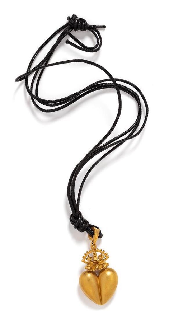An 18 Karat Yellow Gold Pendant Necklace,: An 18 Karat Yellow Gold Pendant Necklace, Kieselstein-Cord, Circa 1987, in a crowned heart design with matte finish, suspended by a woven leather cord necklace. Stamp: B. KIESELSTEIN CORD 1987 (maker'