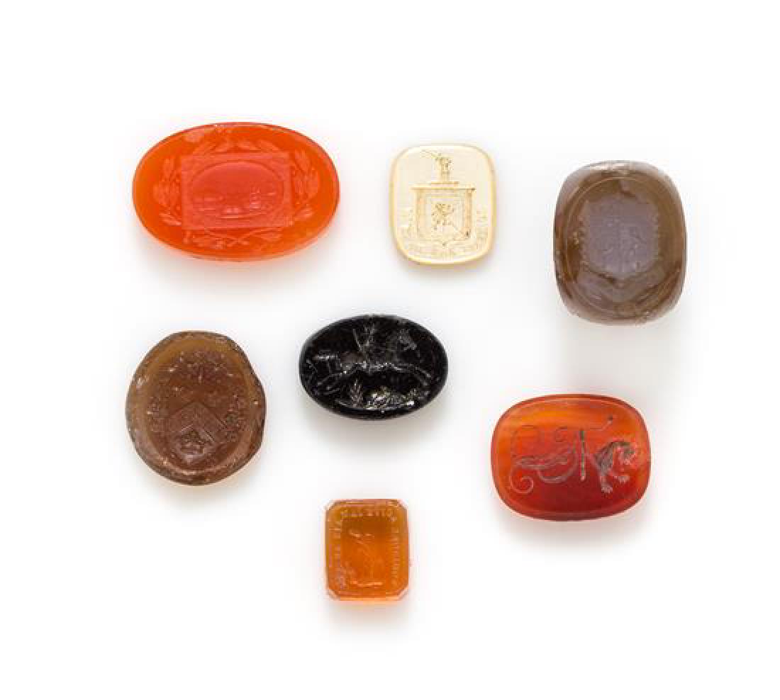 A Collection of Hardstone and Mother-of-Pearl: A Collection of Hardstone and Mother-of-Pearl Intaglios, consisting of seven engraved intaglios of various shapes including agate, carnelian, onyx, glass and mother-of-pearl. 31.35 dwts. Estimate $400