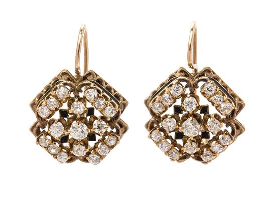 A Pair of Victorian Yellow Gold, Diamond and Enamel: A Pair of Victorian Yellow Gold, Diamond and Enamel Cluster Earrings, consisting of a pierced and textured filigree style containing 42 old European and mine cut diamonds weighing approximately 2.30 c
