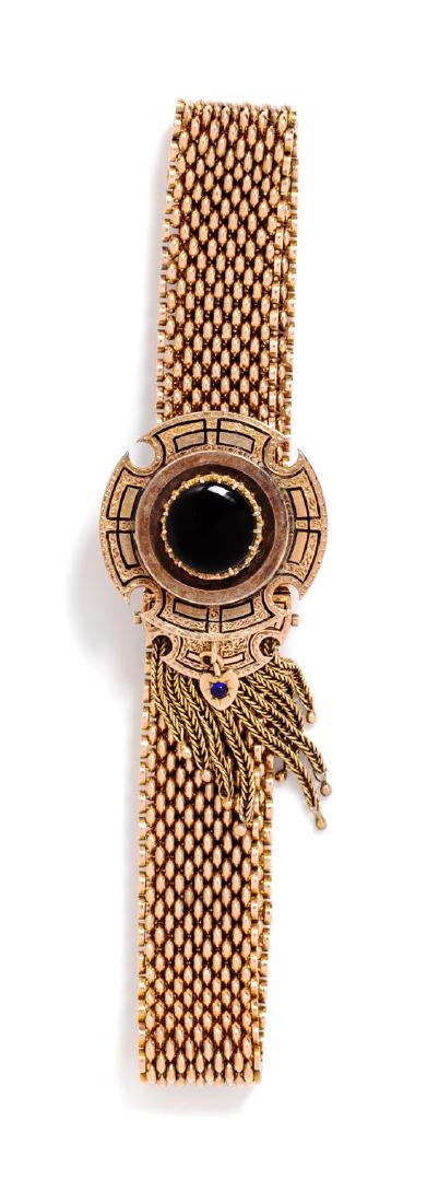 * A 14 Karat Yellow Gold, Onyx and Enamel Slide: * A 14 Karat Yellow Gold, Onyx and Enamel Slide Bracelet, consisting of a mesh chain bracelet measuring approximately 13.25 mm wide with a slide containing one round cabochon cut onyx measuring approx