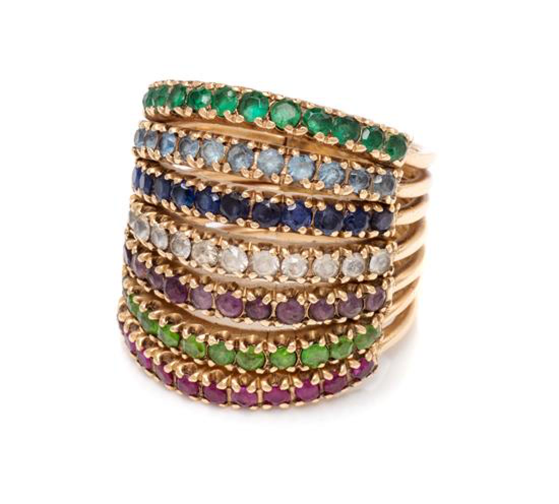 * An Antique Yellow Gold and Multigem Harem Ring, 7.15: * An Antique Yellow Gold and Multigem Harem Ring, consisting of seven conjoined bands containing numerous round mixed cut gemstones including emerald, sapphire, peridot and ruby measuring approximatel