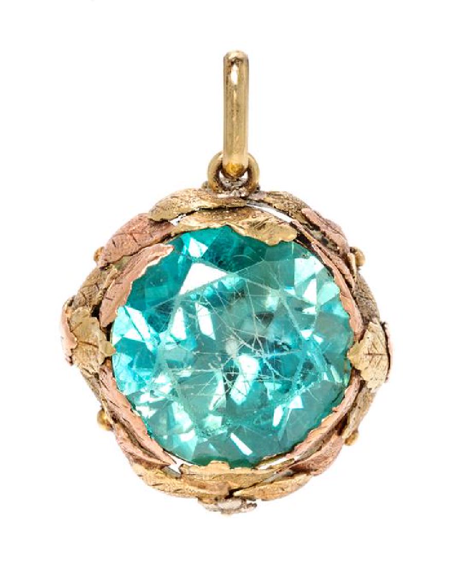 * A Tricolor Gold and Zircon Pendant, 10.20 dwts.: * A Tricolor Gold and Zircon Pendant, containing one round mixed cut blue zircon measuring approximately 18.70 mm in diameter in a yellow and rose gold layered leaf motif surround with white gold flow