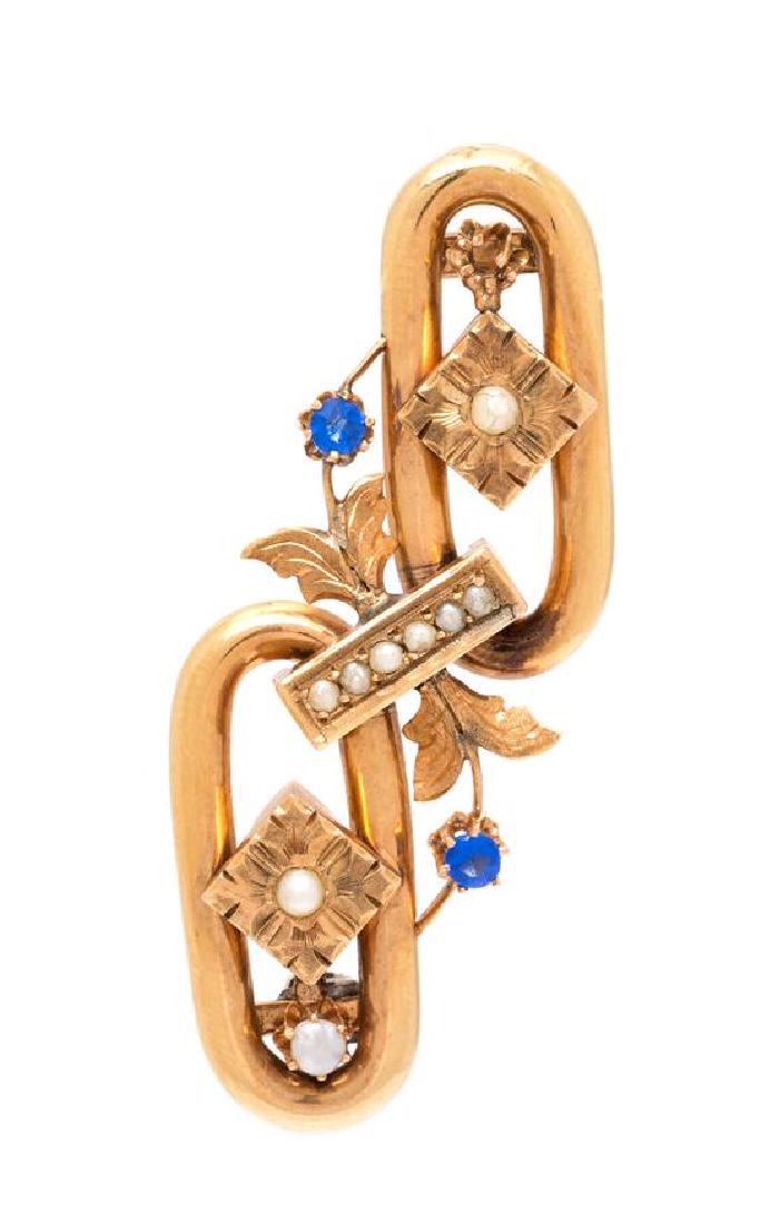 A Yellow Gold, Seed Pearl and Blue Paste Brooch, 6.50: A Yellow Gold, Seed Pearl and Blue Paste Brooch, containing nine seed pearls measuring approximately 1.60-2.65 mm in diameter and two round mixed cut blue paste measuring approximately 2.60 mm in diam