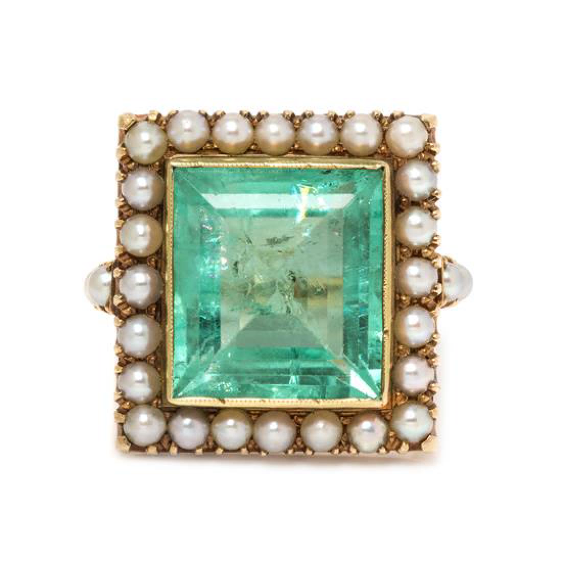 A 14 Karat Yellow Gold, Emerald and Cultured Pearl: A 14 Karat Yellow Gold, Emerald and Cultured Pearl Ring, containing one octagonal step cut emerald measuring approximately 13.11 x 11.49 x 6.39 mm and 28 seed pearls measuring approximately 2.46 mm in