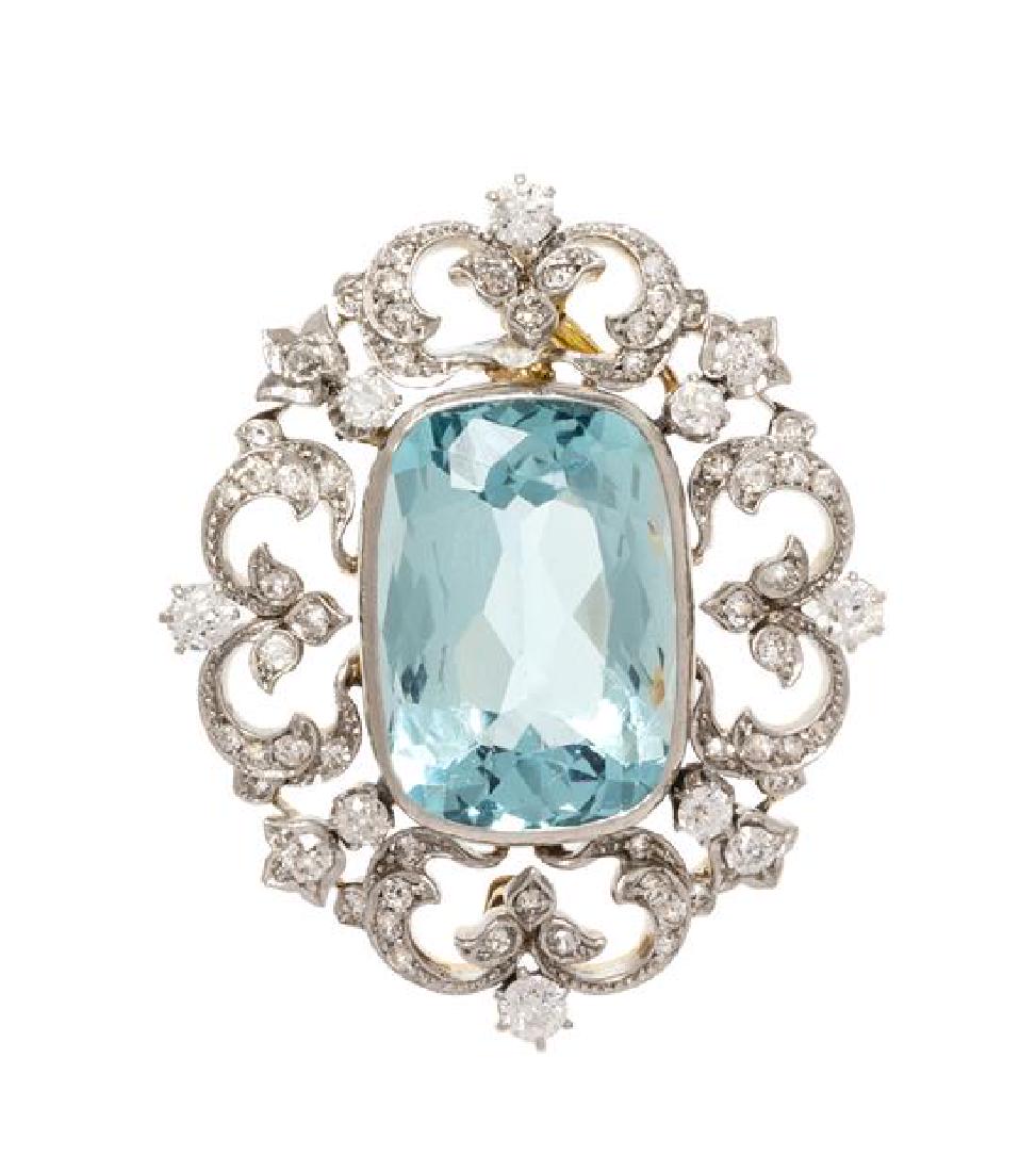 An Edwardian Platinum Topped Yellow Gold, Aquamarine: An Edwardian Platinum Topped Yellow Gold, Aquamarine and Diamond Pendant/Brooch, containing one cushion shape mixed cut aquamarine measuring approximately 19.90 x 13.70 x 9.30 mm, eight old European c
