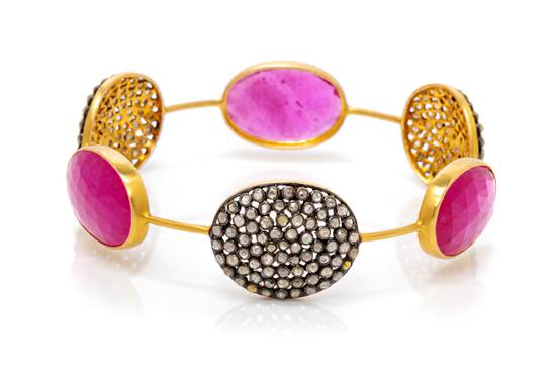 An 18 Karat Yellow Gold, Sterling Silver, Ruby and: An 18 Karat Yellow Gold, Sterling Silver, Ruby and Diamond Bangle Bracelet, containing three oval rose cut rubies measuring approximately 20.60 x 14.30 mm alternating with three silver topped gold pla