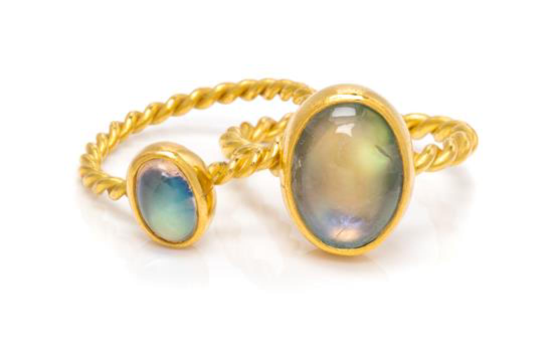 * A Pair of 22 Karat Yellow Gold and Moonstone Rings,: * A Pair of 22 Karat Yellow Gold and Moonstone Rings, consisting of one ring containing one oval cabochon cut moonstone measuring approximately 11.50 x 8.80 mm together with a ring containing one oval