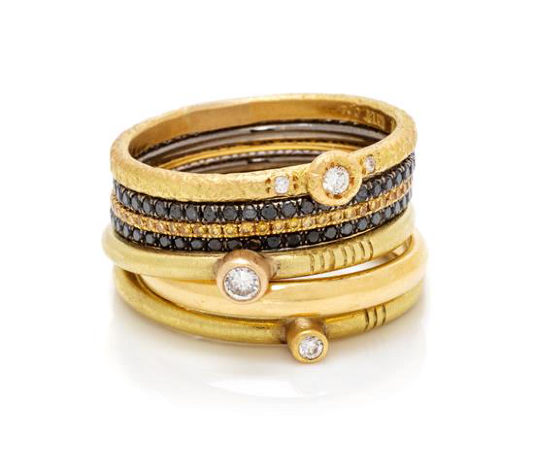 A Collection of Gold, Diamond and Colored Diamond: A Collection of Gold, Diamond and Colored Diamond Stacking Rings, containing two 18 karat yellow gold rings with a matte finish containing two round brilliant cut diamonds weighing approximately 0.09