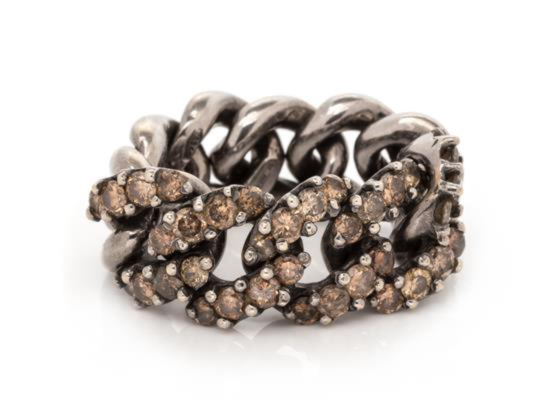 An 18 Karat Blackened Gold and Colored Diamond Chain: An 18 Karat Blackened Gold and Colored Diamond Chain Ring, MIMI, consisting of a curb link chain measuring approximately 9.80 mm wide containing 40 round brilliant cut colored diamonds (origin of colo