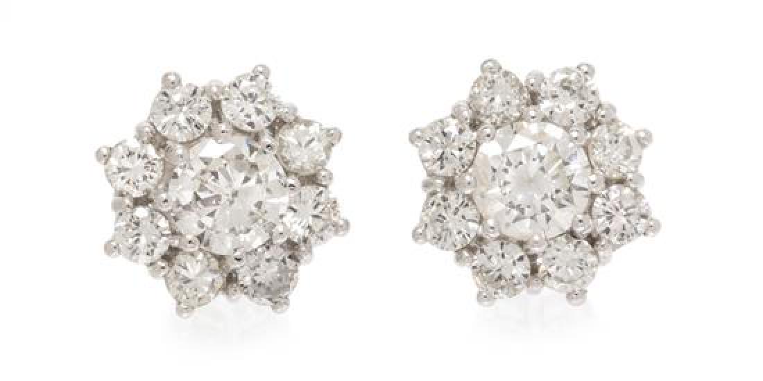 A Pair of Platinum and Diamond Cluster Earrings, 2.25: A Pair of Platinum and Diamond Cluster Earrings, containing two round brilliant cut diamonds weighing approximately 0.62 carat total surrounded by 16 round brilliant cut diamonds weighing approximatel