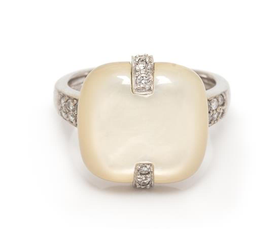 An 18 Karat White Gold, Mother-of-Pearl and Diamond: An 18 Karat White Gold, Mother-of-Pearl and Diamond Ring, Asch Grossbardt, containing one cushion shape mother-of-pearl plaque measuring approximately 13.50 x 14.15 mm and 18 round brilliant cut diamo