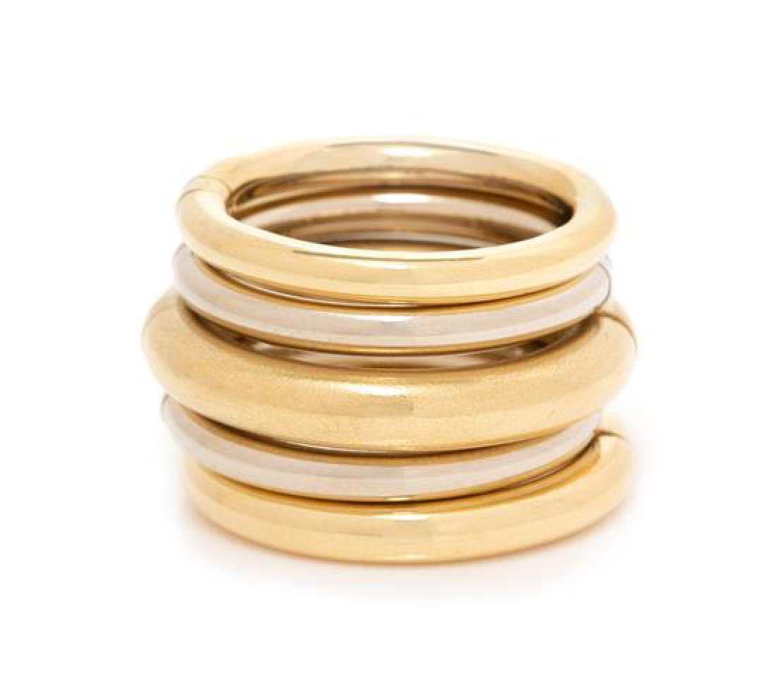 A Bicolor Gold 'Gioco' Ring, Pomellato, 20.90 dwts.: A Bicolor Gold 'Gioco' Ring, Pomellato, consisting of a folding ring design of two white gold and three yellow gold alternating bands. Stamp: Pomellato. 20.90 dwts. Estimate $600-800
