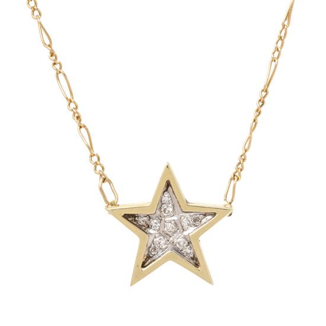 A 14 Karat Bicolor Gold and Diamond Star: A 14 Karat Bicolor Gold and Diamond Star Pendant/Necklace, consisting of a white gold star with a yellow gold border containing 11 round single cut diamonds, suspended by figaro link chain. Stamp: 14K