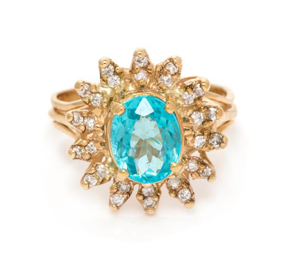 A 14 Karat Yellow Gold, Apatite and Diamond Ring, 3.30: A 14 Karat Yellow Gold, Apatite and Diamond Ring, containing one oval shape mixed cut apatite measuring approximately 8.62 x 6.81 mm and 28 round brilliant cut diamonds weighing approximately 0.20 car