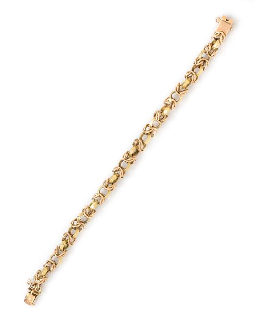 *A Retro 18 Karat Bicolor Gold Byzantine Link Bracelet,: *A Retro 18 Karat Bicolor Gold Byzantine Link Bracelet, measuring approximately 12.00 mm wide. Stamp: 18K. 20.10 dwts. Estimate $600-800 Property From the Estate of Dorothy H Stout, Colorado Springs, 