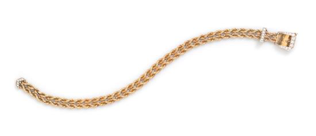 A 14 Karat Bicolor Gold and Diamond Belt Motif: A 14 Karat Bicolor Gold and Diamond Belt Motif Bracelet, consisting of an adjustable double row yellow gold rope chain bracelet with white gold buckle and tip containing 21 round brilliant cut diamond