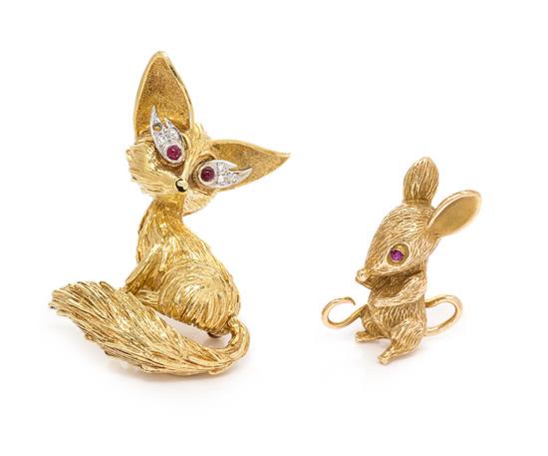 A Collection of Bicolor Gold and Ruby Animal Brooches,: A Collection of Bicolor Gold and Ruby Animal Brooches, consisting of an 18 karat bicolor gold fox brooch containing two round cabochon cut rubies measuring approximately 1.81 mm in diameter and five r