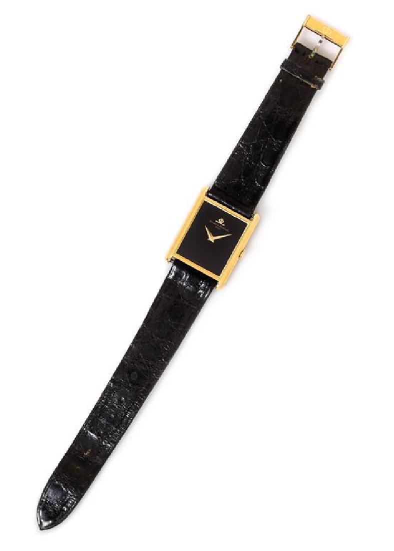 * An 18 Karat Yellow Gold Wristwatch, Baume & Mercier,: * An 18 Karat Yellow Gold Wristwatch, Baume & Mercier, 24.00 x 33.00 mm case dimensions inclusive of lugs, black dial signed BAUME & MERCIER, gold pitched dauphine hands, snap on case back, Cal. BM775