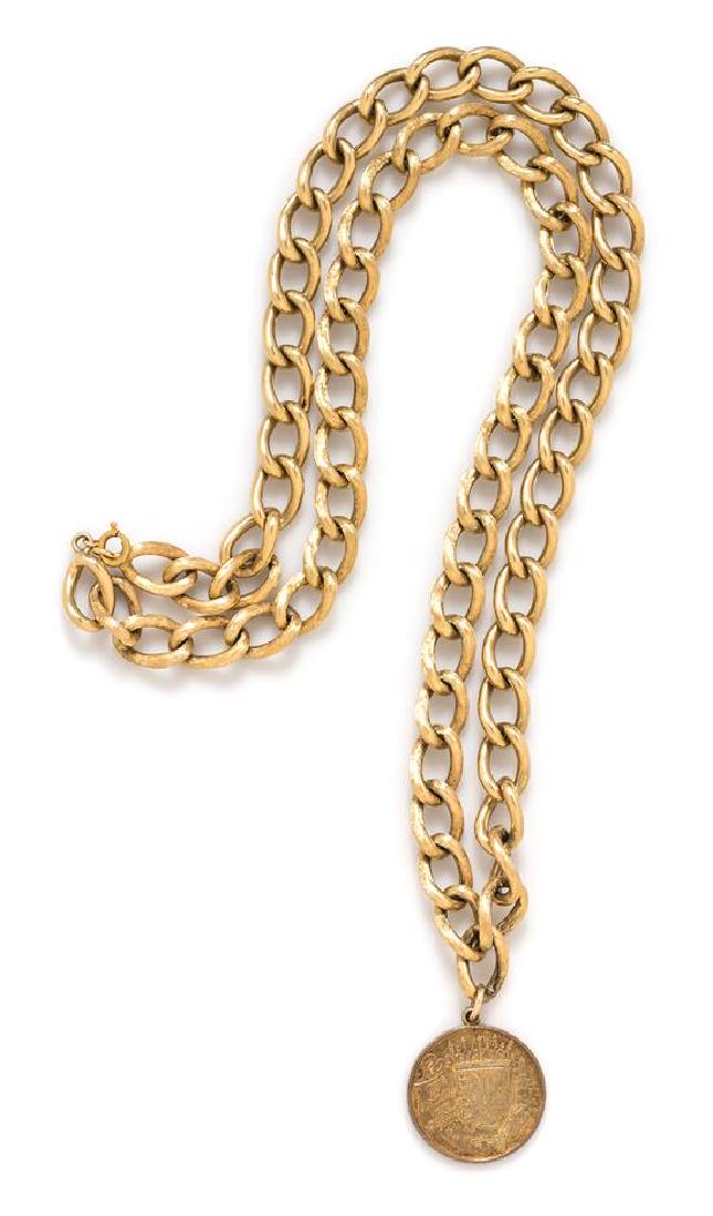 A 14 Karat Yellow Gold Curb Link Chain Necklace with: A 14 Karat Yellow Gold Curb Link Chain Necklace with Coin Pendant, consisting of a textured curb chain measuring approximately 11.10 mm wide. Clasp stamp: 14K. 70.90 dwts. Estimate $1,800-2,200