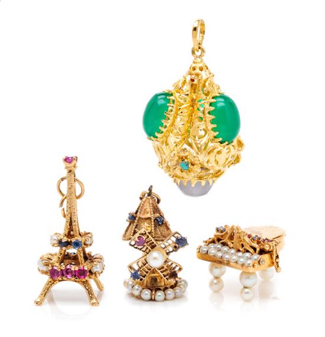 A Collection of Yellow Gold and Multigem Charms, 23.80: A Collection of Yellow Gold and Multigem Charms, consisting of a gold Eiffel Tower charm with round mixed cut rubies, sapphires and cultured pearls, a 14 karat gold windmill charm with round mixed cut