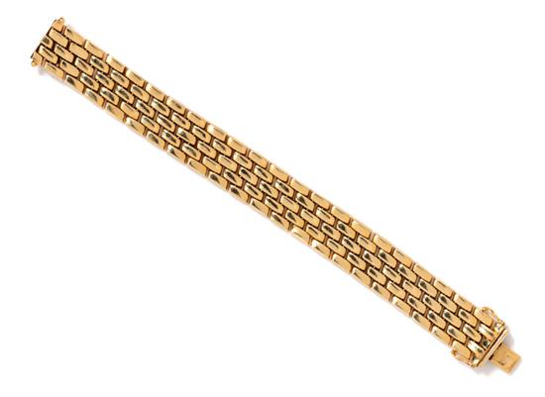 A 14 Karat Yellow Gold Panther Link Bracelet, 23.45: A 14 Karat Yellow Gold Panther Link Bracelet, measuring approximately 16.00 mm wide. Stamp: 585 OE. 23.45 dwts. Estimate $500-700