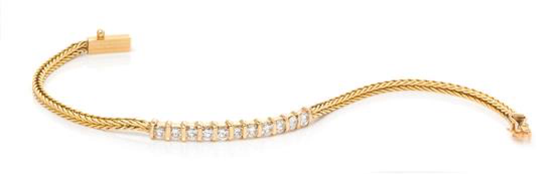 A 14 Karat Yellow Gold and Diamond Bracelet, 3.90 dwts.: A 14 Karat Yellow Gold and Diamond Bracelet, consisting of a central curved section containing 11 round brilliant cut diamonds weighing approximately 1.00 carat total with wheat chain and box clasp. S