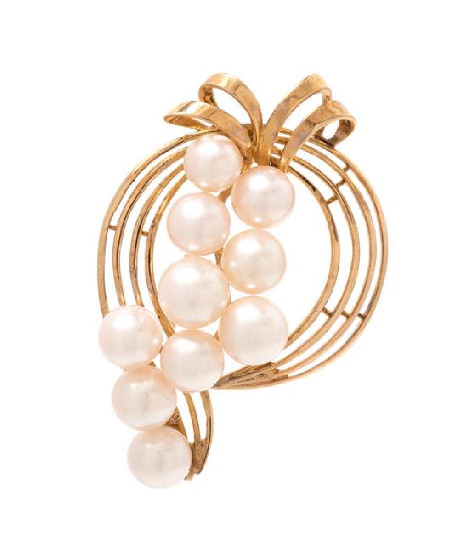 A 14 Karat Yellow Gold and Cultured Pearl Brooch,: A 14 Karat Yellow Gold and Cultured Pearl Brooch, Mikimoto, containing 10 pearls measuring approximately 7.04-7.53 mm in diameter. Stamp: (maker's mark for Mikimoto) K14. 7.90 dwts. Estimate $250-350