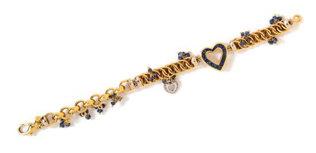 An 18 Karat Bicolor Gold, Sapphire and Diamond: An 18 Karat Bicolor Gold, Sapphire and Diamond Bracelet, Giovane, consisting of a heart shape link containing 20 calibre cut sapphires, with attached rolo and fancy link chain suspending 32 rondelle s