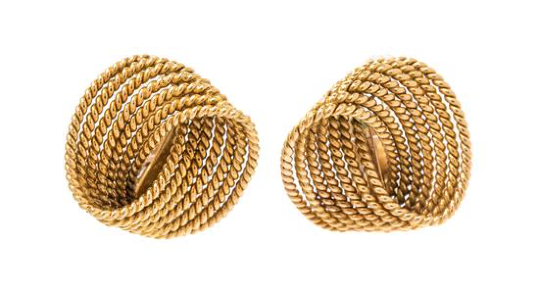 A Pair of 18 Karat Yellow Gold Earclips, Antica Ditta: A Pair of 18 Karat Yellow Gold Earclips, Antica Ditta Marchisio, consisting of a rope texture mobius twist design. Stamp: 750 (Italian hallmark). 6.50 dwts. Estimate $250-350