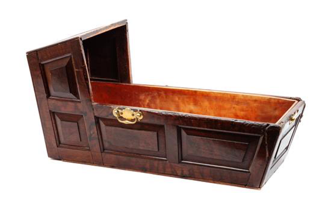 English Mahogany Stained Cradle Form Jardiniere Height: English Mahogany Stained Cradle Form Jardiniere 18th century with copper liner and paneled sides. Height 13 x length 25 x width 10 1/2 inches Estimate $150-250 Property from the Estate of Vernon Taylo