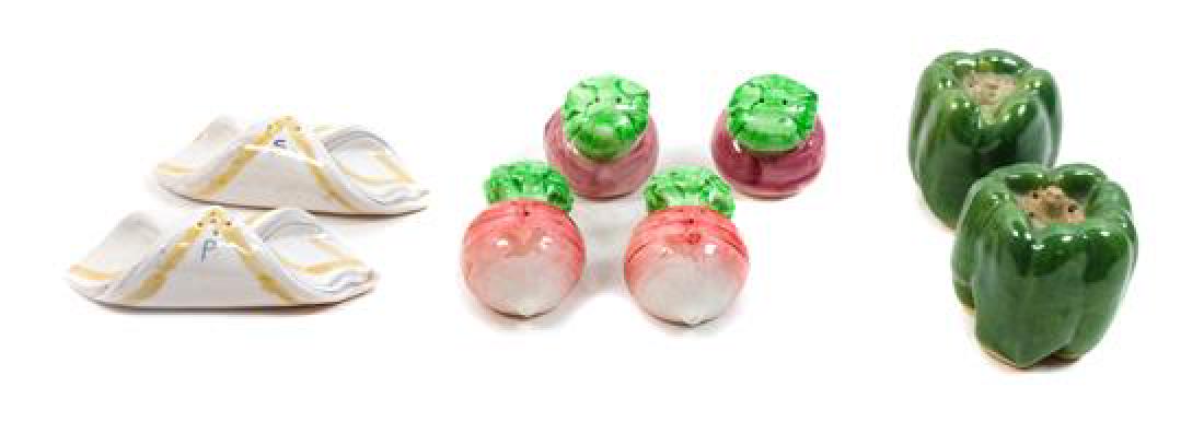 Four Sets of Salt and Pepper Shakers Height of one: Four Sets of Salt and Pepper Shakers including radish form and green pepper form examples. Height of one radish example 2 1/4 inches Estimate $100-200 Property from the Estate of Vernon Taylor Jr., La