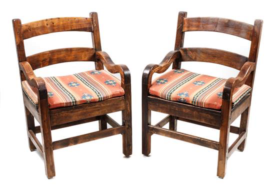 Six Southwestern Wood Arm Chairs Height 26 x width 23: Six Southwestern Wood Arm Chairs with Southwest style upholstery Height 26 x width 23 3/4 x depth 18 1/2 inches Estimate $300-500 Property from the Howard and Catherine Feldman Folk and Southwestern A
